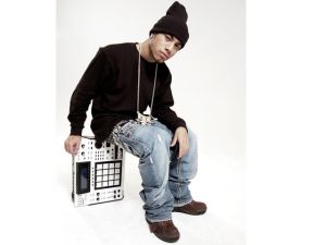AraabMUZIK poses with his MPC, a synthesizer he uses to recreate the sound of a full drum kit. 
